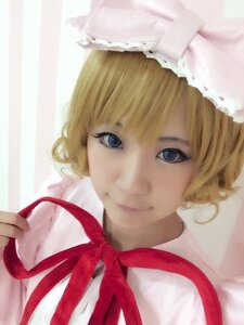 Rating: Safe Score: 0 Tags: 1girl auto_tagged bangs blonde_hair blue_eyes closed_mouth hat hinaichigo lips looking_at_viewer portrait ribbon short_hair smile solo striped striped_background vertical_stripes User: admin