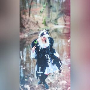 Rating: Safe Score: 0 Tags: 1girl bird black_dress blurry blurry_background blurry_foreground closed_eyes depth_of_field dress feathers flower holding holding_flower long_sleeves solo standing suigintou white_hair User: admin