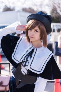 Rating: Safe Score: 0 Tags: 1girl 3d bangs blurry blurry_background brown_eyes brown_hair capelet city day depth_of_field dress hat lips long_sleeves looking_at_viewer neck_ribbon outdoors realistic ribbon short_hair solo souseiseki User: admin