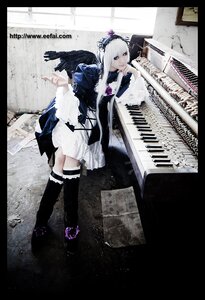 Rating: Safe Score: 0 Tags: 1girl black_border black_legwear boots dress feathers instrument letterboxed long_hair pillarboxed purple_eyes solo standing suigintou thighhighs white_hair wings User: admin
