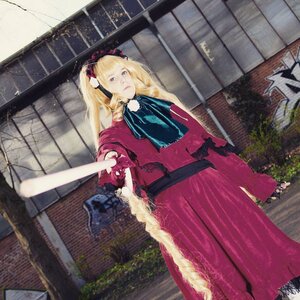 Rating: Safe Score: 0 Tags: 1girl blonde_hair blue_eyes brick_wall building capelet dress fence long_hair shinku solo twintails User: admin
