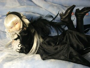 Rating: Safe Score: 0 Tags: 1girl doll dress frilled_sleeves frills hairband long_hair long_sleeves looking_at_viewer lying on_stomach pink_eyes ribbon silver_hair solo suigintou User: admin