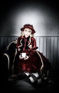 Rating: Safe Score: 0 Tags: 1girl blonde_hair blue_eyes bonnet bow capelet chair cup doll dress flower holding long_hair looking_at_viewer red_dress shinku shoes sitting solo teacup User: admin