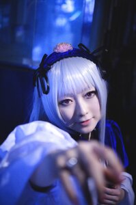 Rating: Safe Score: 0 Tags: 1girl 3d blurry blurry_background blurry_foreground closed_mouth depth_of_field hairband holding holding_weapon lips looking_at_viewer outstretched_arm ribbon silver_hair solo suigintou weapon User: admin