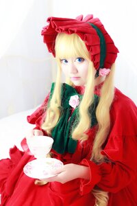Rating: Safe Score: 0 Tags: 1girl blonde_hair blue_eyes bonnet bow cup dress flower long_hair long_sleeves looking_at_viewer pink_rose red_dress rose saucer shinku sitting solo teacup User: admin