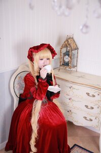 Rating: Safe Score: 0 Tags: 1girl bangs blonde_hair blue_eyes bonnet cup dress flower holding_cup long_hair long_sleeves red_dress shinku solo teacup User: admin