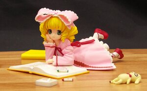 Rating: Safe Score: 0 Tags: 1girl blonde_hair book bow doll dress figure frills green_eyes hina_ichigo hinaichigo long_sleeves looking_at_viewer lying on_stomach open_book photo_(medium) pink_bow pink_dress rozen_maiden shoes short_hair smile socks solo User: admin