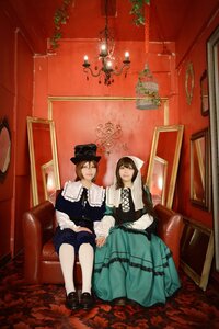 Rating: Safe Score: 0 Tags: 2girls black_hair brown_hair couch dress flower hat indoors long_hair multiple_cosplay multiple_girls plant rose shoes sitting tagme top_hat User: admin