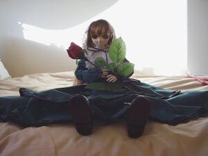 Rating: Safe Score: 0 Tags: 1girl bed brown_eyes brown_hair doll dress flower long_hair long_sleeves sitting solo suiseiseki User: admin