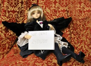 Rating: Safe Score: 0 Tags: 1girl black_dress black_legwear blonde_hair doll dress frills gothic_lolita lolita_fashion long_hair long_sleeves looking_at_viewer sitting solo suigintou User: admin