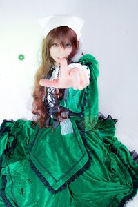 Rating: Safe Score: 0 Tags: 1girl blue_eyes brown_hair dress frills green_dress hands lips long_hair long_sleeves looking_at_viewer outstretched_arm smile solo suiseiseki User: admin