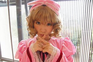 Rating: Safe Score: 0 Tags: 1girl blonde_hair blue_eyes bow curly_hair dress drill_hair finger_to_mouth indoors long_sleeves looking_at_viewer pink_dress puffy_sleeves ribbon short_hair smile solo striped sunlight upper_body window User: admin