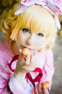 Rating: Safe Score: 0 Tags: 1girl blonde_hair blurry blurry_background blurry_foreground bow depth_of_field dress eating food frills green_eyes hat hinaichigo holding_food lips looking_at_viewer photo realistic red_ribbon ribbon short_hair solo User: admin