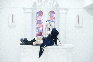 Rating: Safe Score: 0 Tags: 1girl black_footwear boots high_heels long_hair sitting solo suigintou umbrella white_hair User: admin
