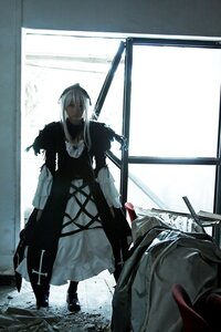 Rating: Safe Score: 0 Tags: 1girl coat gun hair_over_one_eye indoors long_hair long_sleeves solo standing suigintou weapon window User: admin