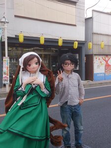 Rating: Safe Score: 0 Tags: 1boy 1girl black_hair brown_hair building dress glasses heterochromia lamp pants sign smile solo standing suiseiseki User: admin