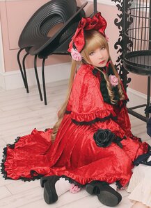 Rating: Safe Score: 0 Tags: 1girl bangs black_footwear blonde_hair blue_eyes bonnet bow dress flower frills lips long_hair looking_at_viewer red_dress rose shinku sitting solo User: admin