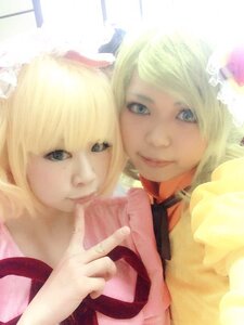 Rating: Safe Score: 0 Tags: 2girls 3d bangs blonde_hair blue_eyes choker kagamine_rin lips looking_at_viewer multiple_cosplay multiple_girls ribbon short_hair siblings smile tagme twins User: admin