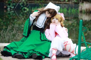 Rating: Safe Score: 0 Tags: 2girls apron blonde_hair blue_eyes blurry brown_hair closed_eyes depth_of_field dress flower green_dress hat head_scarf long_hair long_sleeves multiple_cosplay multiple_girls outdoors pantyhose sitting striped striped_legwear suiseiseki tagme tree User: admin