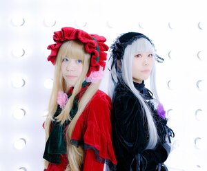 Rating: Safe Score: 0 Tags: 2girls 91076 back-to-back bangs blonde_hair blue_eyes bonnet feathers flower lips long_hair looking_at_viewer multiple_cosplay multiple_girls petals red_eyes rose shinku silver_hair striped suigintou tagme upper_body User: admin