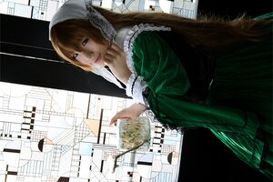 Rating: Safe Score: 0 Tags: 1girl auto_tagged brown_hair building city dress green_dress lips long_hair looking_at_viewer solo suiseiseki User: admin