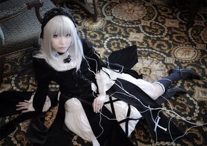 Rating: Safe Score: 0 Tags: 1girl black_dress dress frills long_sleeves looking_at_viewer pale_skin red_eyes ribbon sitting solo suigintou white_hair User: admin