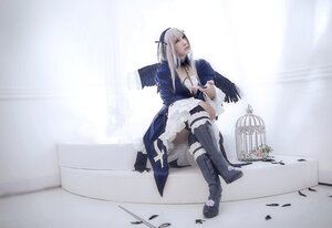 Rating: Safe Score: 0 Tags: 1girl boots breasts cleavage dress feathers long_hair necklace sitting solo suigintou thighhighs white_hair User: admin