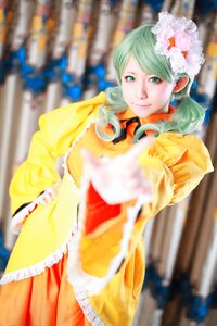 Rating: Safe Score: 0 Tags: 1girl 3d blurry blurry_background blurry_foreground depth_of_field flower frills green_eyes green_hair kanaria looking_at_viewer motion_blur photo smile solo User: admin