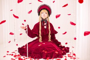 Rating: Safe Score: 0 Tags: 1girl blonde_hair blue_eyes bonnet dress flower long_hair petals red_dress rose rose_petals shinku sitting solo striped User: admin