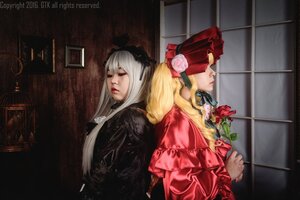 Rating: Safe Score: 0 Tags: 2girls 91076 back-to-back blonde_hair bonnet closed_eyes flower lips long_hair multiple_cosplay multiple_girls rose shinku tagme User: admin