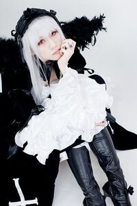 Rating: Safe Score: 0 Tags: 1girl boots hairband long_hair long_sleeves looking_at_viewer nail_polish pants red_eyes sitting solo suigintou User: admin