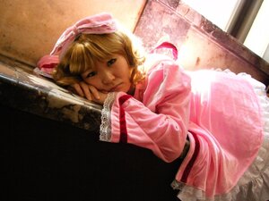Rating: Safe Score: 0 Tags: 1girl blonde_hair blue_eyes bow dress hair_ribbon hinaichigo indoors lips long_sleeves looking_at_viewer lying pink_dress realistic ribbon solo sunlight window User: admin