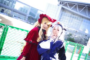 Rating: Safe Score: 0 Tags: 2girls blonde_hair blurry bonnet building city depth_of_field dress fence indoors long_hair looking_at_another multiple_cosplay multiple_girls tagme User: admin