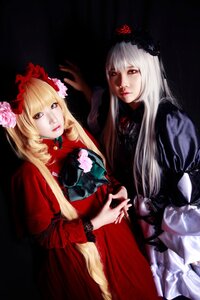 Rating: Safe Score: 0 Tags: 2girls blonde_hair blue_eyes dress flower hair_ornament hands_together holding_hands lips long_hair multiple_cosplay multiple_girls realistic red_dress rose shinku tagme User: admin