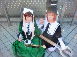 Rating: Safe Score: 0 Tags: 2girls bangs brown_hair building dress fence green_dress hat long_hair long_sleeves looking_at_viewer multiple_cosplay multiple_girls sisters smile standing suiseiseki tagme tile_floor tiles User: admin