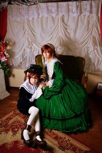 Rating: Safe Score: 0 Tags: 2girls brown_hair closed_eyes curtains dress flower green_dress hat holding_hands long_sleeves multiple_cosplay multiple_girls sitting suiseiseki tagme twins white_legwear User: admin