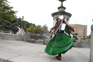 Rating: Safe Score: 0 Tags: 1girl brown_hair building day dress green_dress hat long_hair long_sleeves outdoors shoes solo standing suiseiseki User: admin