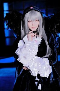 Rating: Safe Score: 0 Tags: 1girl black_dress closed_mouth dress frills gothic_lolita hairband lolita_fashion long_hair long_sleeves looking_at_viewer nail_polish red_eyes smile solo suigintou User: admin