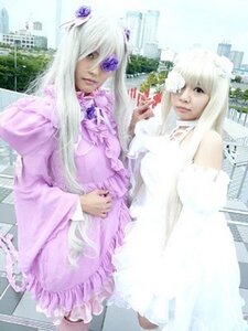 Rating: Safe Score: 0 Tags: 2girls blonde_hair building dress frills hair_ornament long_hair multiple_cosplay multiple_girls siblings standing tagme User: admin