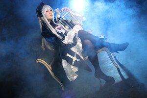 Rating: Safe Score: 0 Tags: 1girl chair dress frills lips long_hair long_sleeves silver_hair sitting solo suigintou User: admin