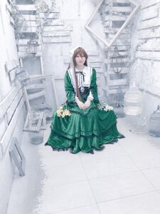 Rating: Safe Score: 0 Tags: 1girl brown_hair building city dress flower green_dress long_hair long_sleeves solo standing suiseiseki User: admin