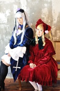 Rating: Safe Score: 0 Tags: 2girls 91076 blonde_hair blue_dress bonnet dress frills hat long_hair long_sleeves multiple_cosplay multiple_girls red_dress rose shinku sitting suigintou tagme white_legwear User: admin