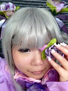 Rating: Safe Score: 0 Tags: 1girl bangs barasuishou brown_eyes close-up face flower hair_ornament hands lips portrait ribbon solo User: admin