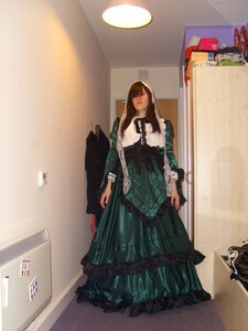 Rating: Safe Score: 0 Tags: 1girl brown_hair closed_eyes dress frills green_dress indoors long_hair long_sleeves solo standing suiseiseki wooden_floor User: admin