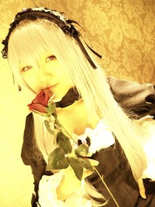 Rating: Safe Score: 0 Tags: 1girl choker dress hairband sepia solo suigintou yellow_background yellow_theme User: admin