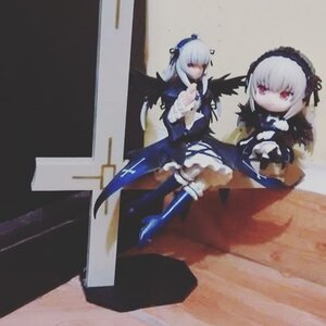 Rating: Safe Score: 0 Tags: black_wings doll dress figure frills hairband long_hair long_sleeves photo ribbon silver_hair sitting solo standing suigintou wings User: admin