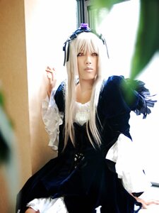 Rating: Safe Score: 0 Tags: blurry blurry_background closed_mouth depth_of_field dress frills long_sleeves looking_at_viewer red_eyes solo standing suigintou User: admin