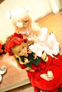 Rating: Safe Score: 0 Tags: 2girls 91076 blonde_hair blue_eyes bonnet cup dress flower frills long_hair long_sleeves looking_at_viewer multiple_cosplay multiple_girls red_dress rose shinku sitting tagme tea teacup User: admin