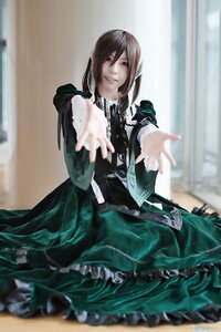 Rating: Safe Score: 0 Tags: 1girl blurry blurry_background blurry_foreground brown_hair depth_of_field dress frills green_dress indoors long_sleeves looking_at_viewer outstretched_arm outstretched_hand reaching reaching_out smile solo suiseiseki User: admin