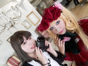 Rating: Safe Score: 0 Tags: 2girls blonde_hair blue_eyes camera indoors lips long_hair looking_at_viewer multiple_girls realistic shinku smile solo User: admin